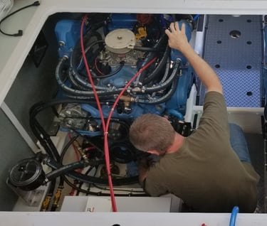 man working in engine room of boat