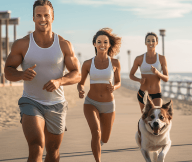 Group of men and women jogging at the beach