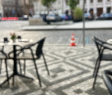 a table with a glass of wine and a glass of wine, blurry