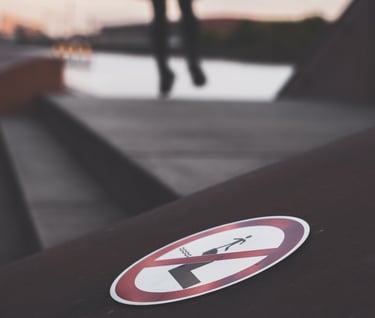 a jumping in the air while a no jumping sign is displayed