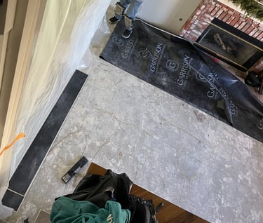Tenting off the dining room so they can grind the concrete and not get dust everywhere!