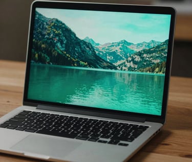 A lifestyle shot of a high-end laptop on a wooden desk showing the finished video. The screen displays a vibrant, professionally color-graded landscape in seafoam green.