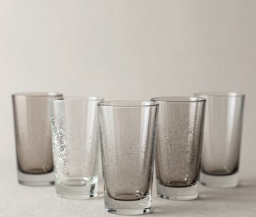 A row of stunning custom glitter tumblers with professional finishes in a palette of #D4BEAE and #8C6B5E. Clean, modern composition on a neutral background.