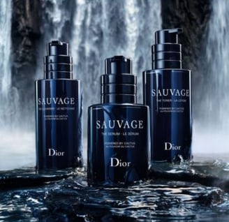 a group of three bottles of dior sauvage