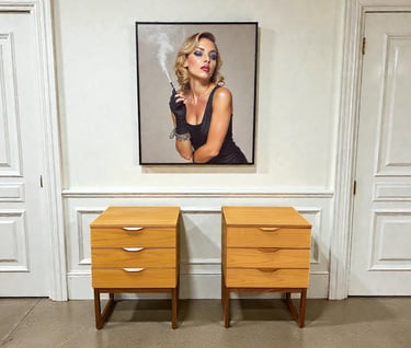 wo Europa mid-century bedside tables with clean modern lines and elegant vintage design