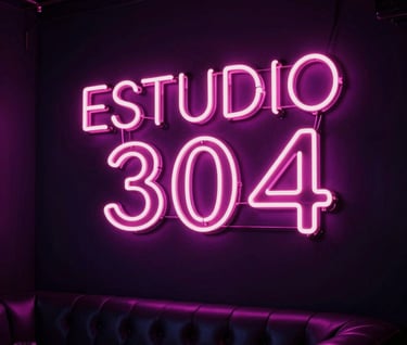 Beautiful modern dark interior of a club or studio with a glowing pink neon sign that reads "ESTUDIO 304" in stylized neon lights, Latin American / Global styled luxury lounge background, electrifying neon violet shadows, cinematic depth of field.