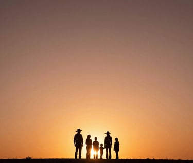 A wide, cinematic landscape shot of a Western / Global family silhouette against a sun-drenched sunset. The sky is a deep Terracotta and Soft Sand gradient. The mood is nostalgic, premium, and timeless.