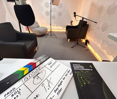 Professional podcast studio with movie clapperboard, studio lighting, microphones, and soundproof walls.