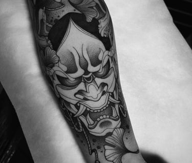 a tattoo style tattoo on a forearm of a man's arm
