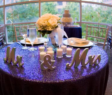 Bride and Groom center table with Mr and Mrs signs.. Wedding at Rockville Arts & Innovation Center,