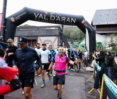 a man running in a race with a woman in pink