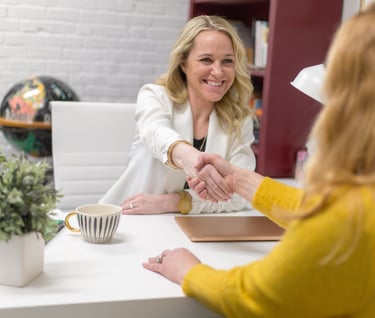 smiling woman welcoming new client