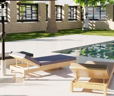 a patio with a pool and 3 sun lounger 