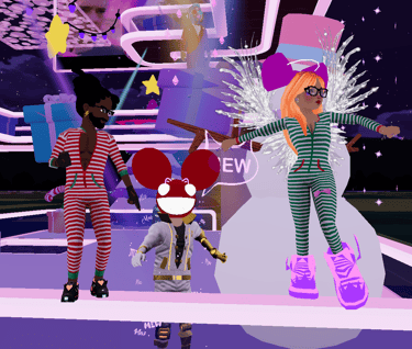 a group of people standing around a stage