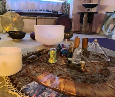 Sacred healing tools including crystals and sound instruments used alongside Reiki healing