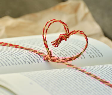 a book with a heart shaped knot tied to a book, a book for awareness, meditation and mindfulness