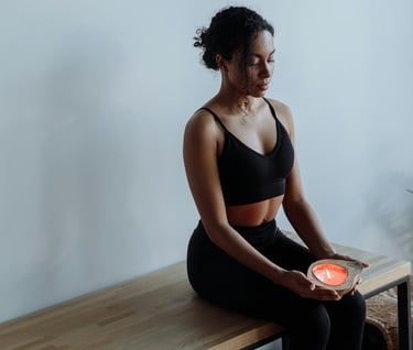 a woman sitting on the floor meditating