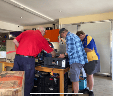 President Keith, Secretary Andrew, and Graham work on the BBQ - without the sausages this time!