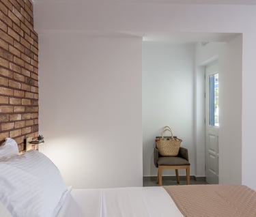 a bedroom with a bed and a chair