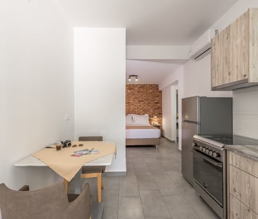 a kitchen with a table and chairs and a table