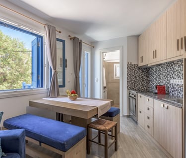 a kitchen with a table and chairs and a refrigerator