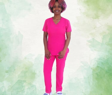 a woman in a pink scrub suit standing in front of a green background