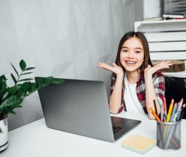 Student enjoying online maths tutoring on laptop