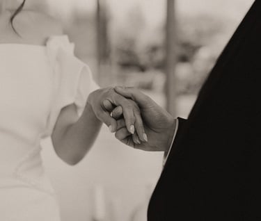 a bride and groom holding hands in a wedding ceremony