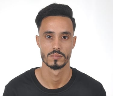 man standing near white wall