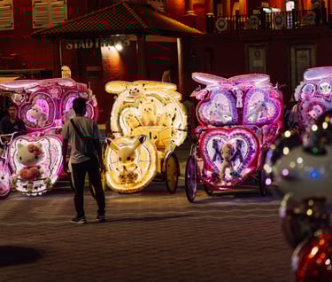 a man standing in front of a large number of clocks