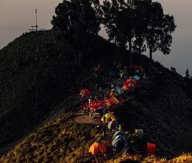 a group of people are gathered around a mountain