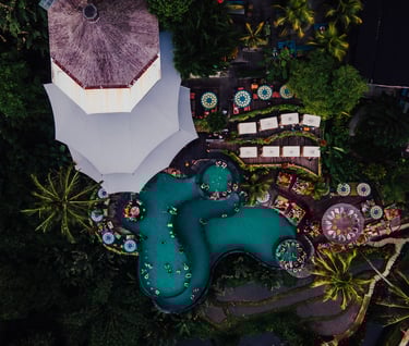 a pool with a view of a resort