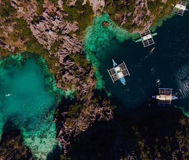 a group of boats floating on a river