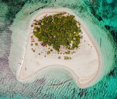 a small island with a small island in the middle of the ocean
