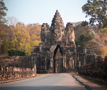a large stone archway with a gate in the middle