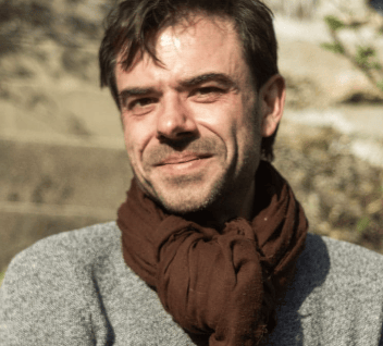 a man with a scarf around his neck