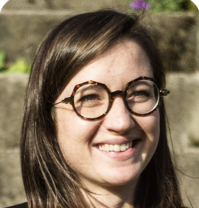 a woman with glasses and a black shirt