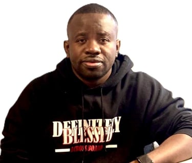 a man in a black hoodie and a watch on his wrist