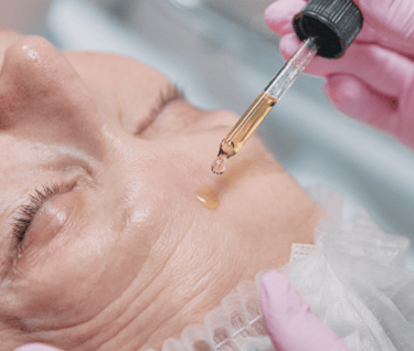 a woman is getting a facelift