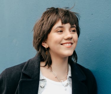 a woman with a white shirt and black jacket