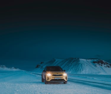 a car driving on a snowy road