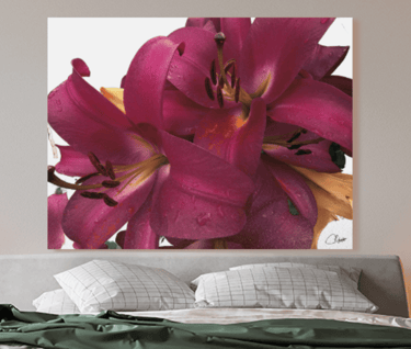 Wall Canvas Print with Lily Flowers printed on it above a bed with pillows and bedding on it
