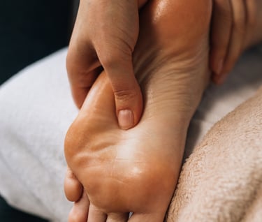 a person is getting a foot massage