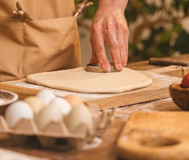 cook preparing dough to make pastries