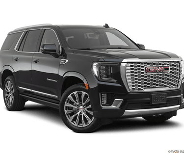Stylish GMC Yukon XL Denali showcased against the urban backdrop of downtown Columbus, Ohio, embodyi