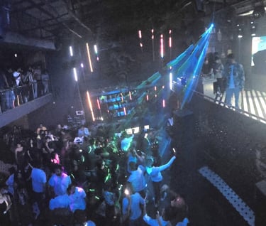 a crowd of people standing around a stage
