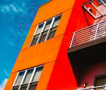 a red building with a balcony and a balcony