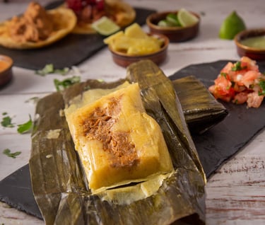 La imagen de un exquisito tamal hecho con la receta de tamales mexicanos