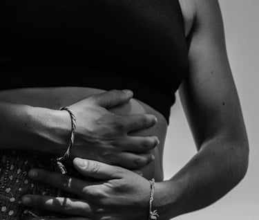 a woman in a black and white photo of her belly