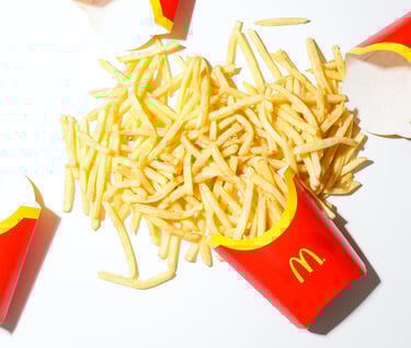 a pile of fries on a table with fries and fries